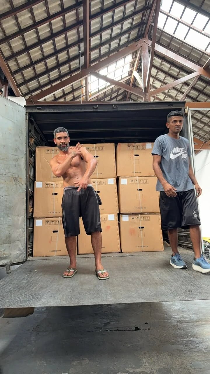 Customer test riding FOXSCOO motorcycle at warehouse